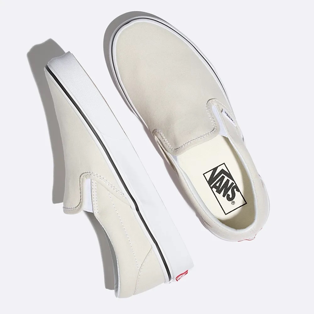 Vans Cream Slip-On Sneakers